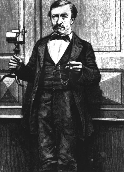 Abbildung von Johann Philipp Reis mit einem Telefon in der Hand